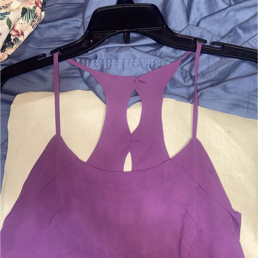 A purple tank top/dress shirt with a half button back